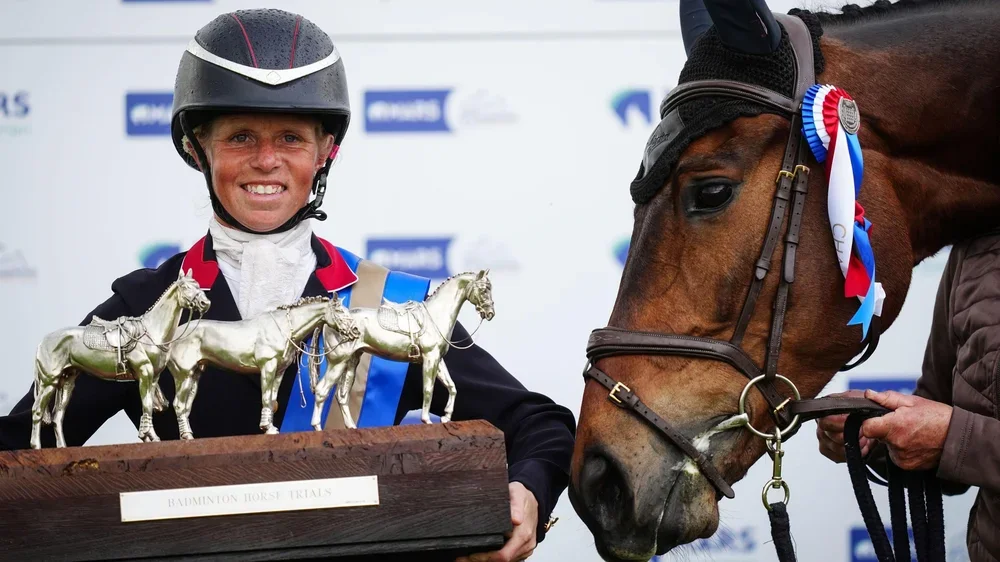 British rider Ros Canter celebrates with the Badminton Horse Trials trophy after winning on her horse Lordships Graffalo